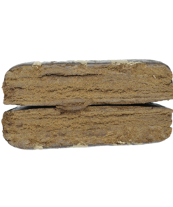 Two rectangular pieces of brown compressed material stacked horizontally on a plain background, showing a textured cut surface.